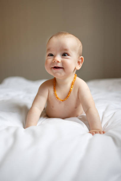 istock Baby girl lying on the bed 1440574826