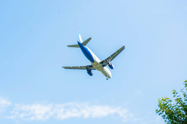 Travel by air transport. Airplane landing. Airplane in the sky. stock photo