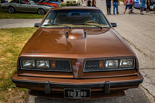 Des Moines, IA - July 02, 2022: High perspective front view of a 1979 Pontiac Sunbird Sport Coupe at a local car show.