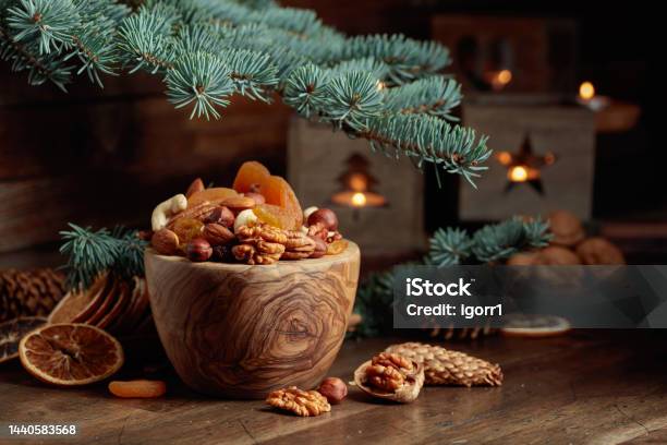 Dried Fruits And Assorted Nuts On An Old Wooden Table Stock Photo - Download Image Now