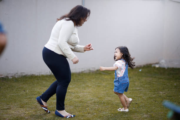 istock Mother and daughter bonding on the playground 1440588448