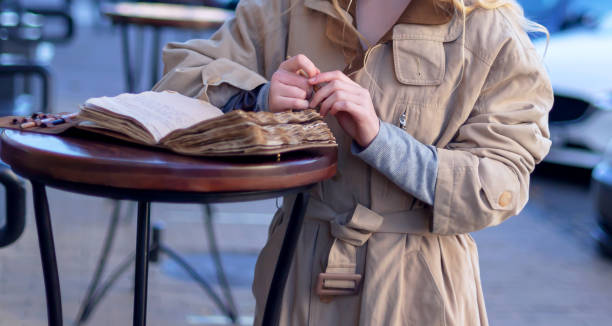 istock A girl stands with a diary 1440590247