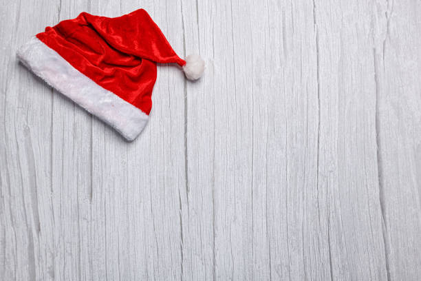christmas hat on wooden background close-up