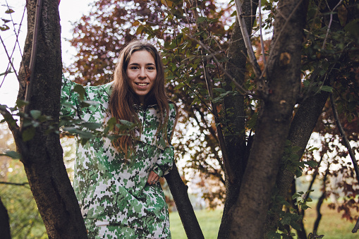 A young female adult posing for portrait photos in an adventure like environment.