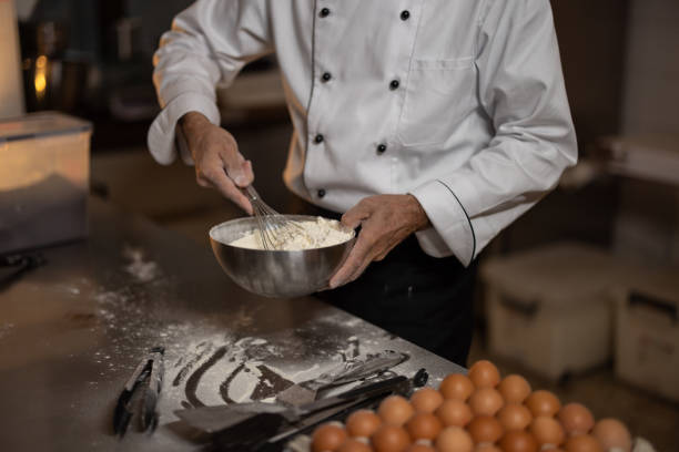 istock A baker prepares bakery products in a bakery. 1440596431