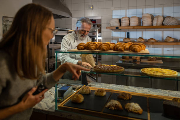istock A baker prepares bakery products in a bakery. 1440597796