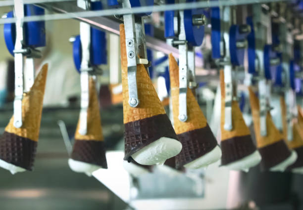 ice cream cones on conveyor. ice cream factory. - semi skimmed milk imagens e fotografias de stock