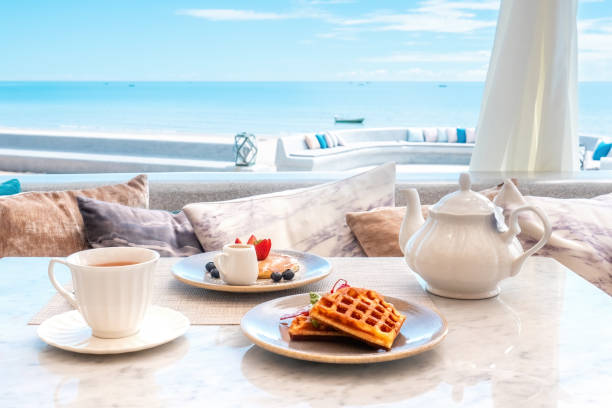istock Sweet breakfast in cafe with belgian waffles, pancakes with berries 1440598246