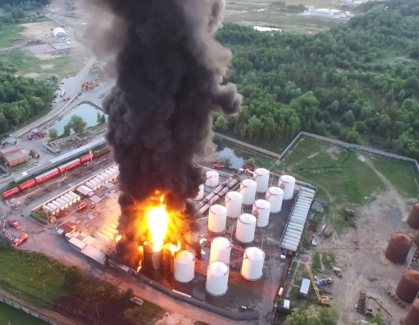 fire at the farm. combustion of fuel tanks. - naphtha imagens e fotografias de stock