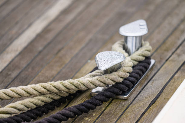 Shiny bollards on a wooden boat deck.