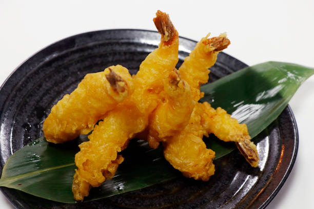 istock tempura battered crispy fried shrimps or prawns with white background 1440603134