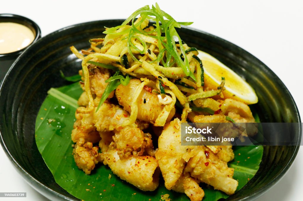 Crispy Fried Squid Or Calamari In A Plate With White Background Stock