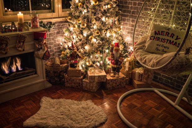 istock Decorated Christmas Tree Near Fireplace at Home 1440605412