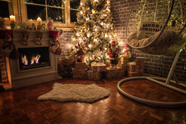 istock Decorated Christmas Tree Near Fireplace at Home 1440605433