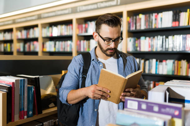 istock College student looking for a book for his academic research 1440606858