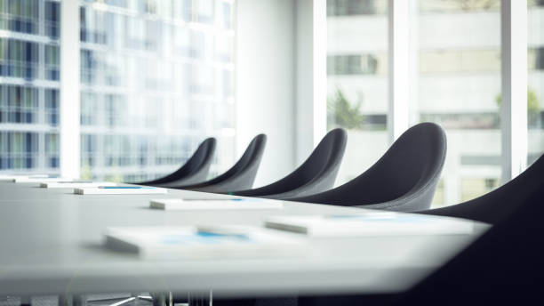 chairs in meeting room inside business building 3D rendering of table and chairs or armchairs for participants of management level and leadership at meeting in Conference Room of office building in front of bright window chairperson stock pictures, royalty-free photos & images