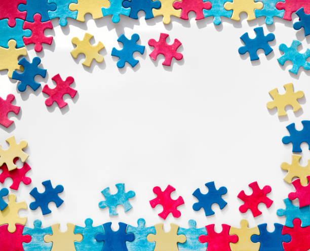 istock Autism Awareness Day, World Autism Day, rectangular frame with puzzle pieces, copy-space. Design element or background for flyer, poster for Health Care Autism Awareness campaign. 1440614886