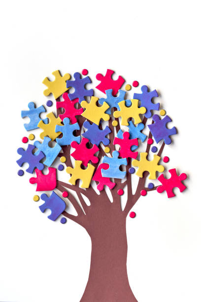 istock vAbstract tree with colorful vibrant puzzle pieces on off white background. Autism Awareness Day, World Autism Day decorative element for banner, wallpaper. Creative background for flyer or poster. 1440614904