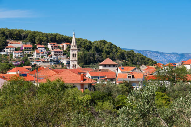 Jelsa, Hvar island in Croatia. The scenic summer day view of the city of Jelsa. Jelsa, Hvar island in Croatia, panoramic banner image. Scenic summer day panorama view of the city of Jelsa. jelsa stock pictures, royalty-free photos & images
