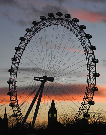 Sunset over the Millennium Wheel and Big Ben, Westminster skyline, London. UK
