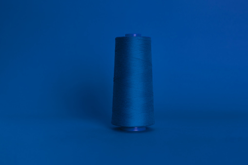 blue line spool in blue background