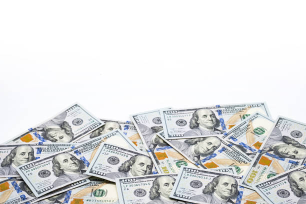 istock One hundred dollar bills. U.S. paper currency background. 1440625768
