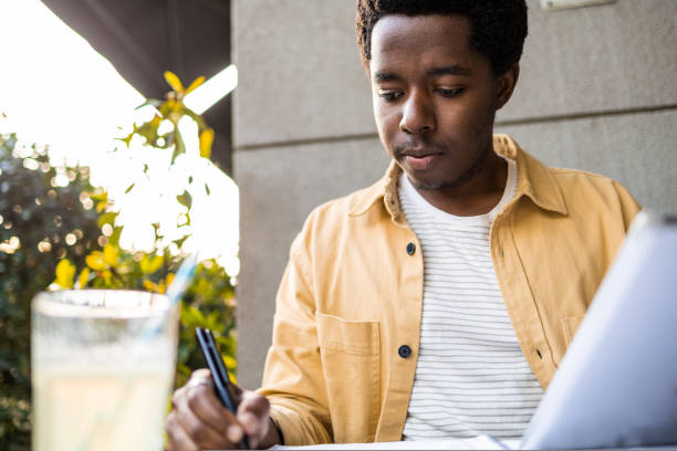 istock African American studying online outdoors 1440625822