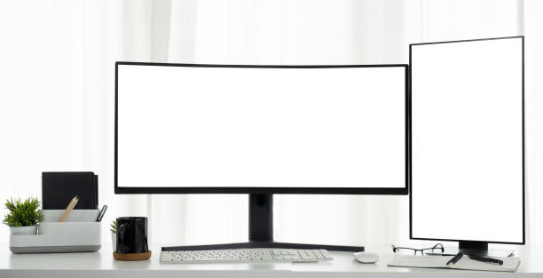 istock Front view of large curved and vertical computer monitor with blank display on a white table. 1440631473