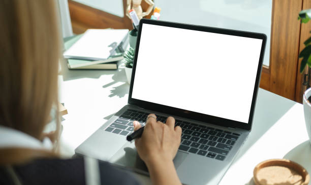 istock Focused businesswoman using laptop computer at bright modern office. 1440632163