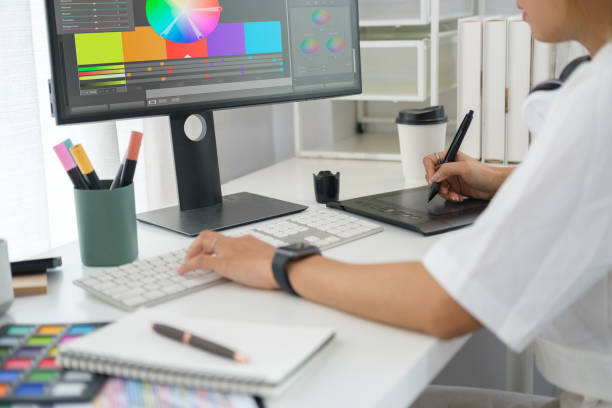 istock Cropped shot of young creative woman using graphics tablet and a stylus pen at creative office. 1440633231