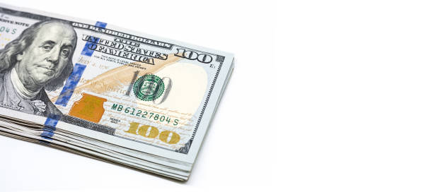 istock Some one hundred dollar bills. Stack of American cash on white. 1440636769