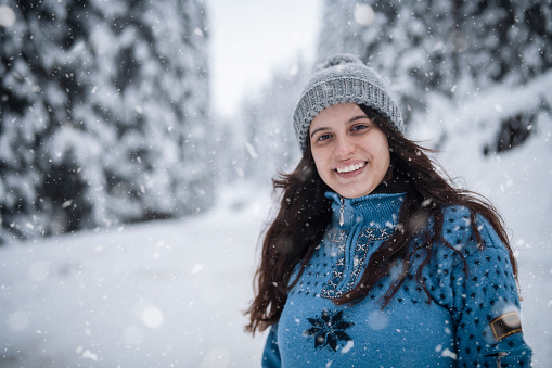 Portrait of a smiling beautiful woman in winter.