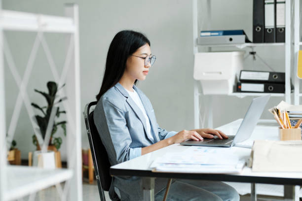 istock Young asian business woman or student working online on computer laptop. 1440646513