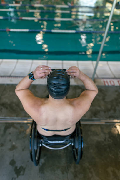 istock Athlete With Disability Preparing To Swim 1440646682