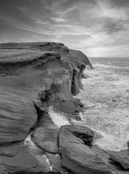 Iles De La Madeleine cliffs black and white stock photo