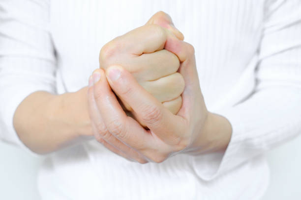 The man clenched his fists, exhibiting stressful and angry behavior from work. feeling of dissatisfaction Medical concepts and emotional regulation