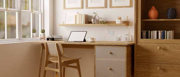 istock Scandinavian and comfortable home working room interior with tablet mockup on wood table 1440655884
