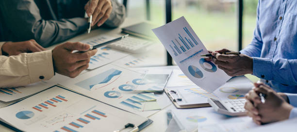 istock Discussion of reports displayed in charts and graphs. analyze financial statistics Take part in the overview brainstorming business people review analyze serious financial reports 1440658312