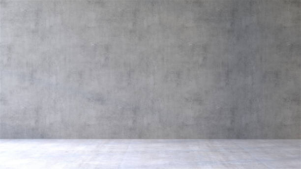 Front view of empty room with concrete wall and cement floor in sunlight from window