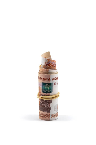 istock Rolled up five thousand rubles bills on white. Roll of Russian currency. 1440660347