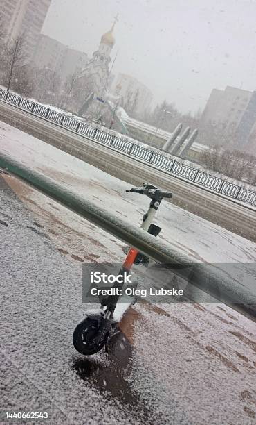 Electric Scooter Under The Snow Stock Photo - Download Image Now - Abandoned, Alternative Lifestyle, Bicycle Sharing System