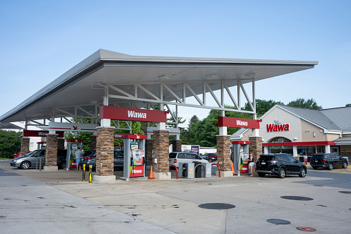Malvern, PA, USA - June 26, 2022: A Wawa convenience store and gas station in Malvern, Pennsylvania. Wawa, Inc. is an American chain of convenience stores and gas stations along the East Coast.
