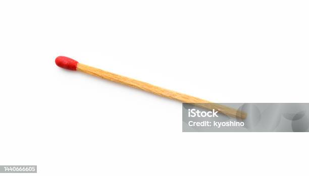 Isolated Shot Of Old Match Stick On White Background Stock Photo - Download Image Now