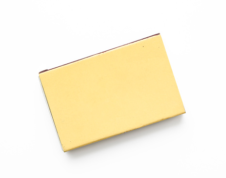 Overhead shot of closed old matchbox, isolated on white with clipping path.