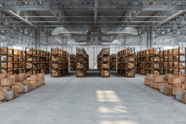 Distribution Warehouse With Cardboard Boxes On The Racks And On The Floor stock photo