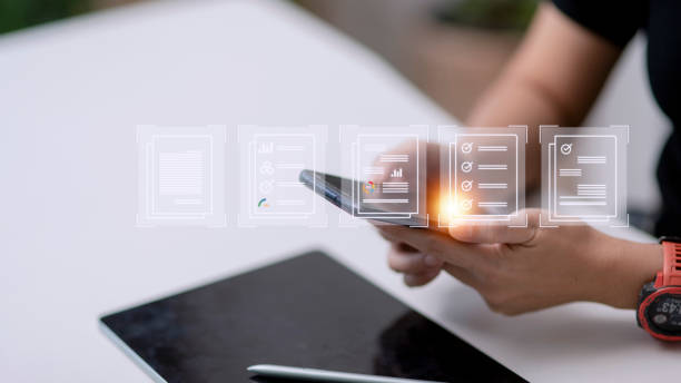 istock Paperless workplace ideas, e-signing, electronic signature, document management. A businessman signs an electronic document on a digital document on a virtual screen 1440671278