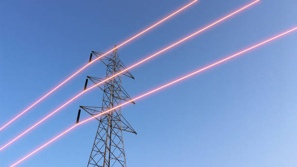 istock Electricity transmission towers with glowing wires 1440672121