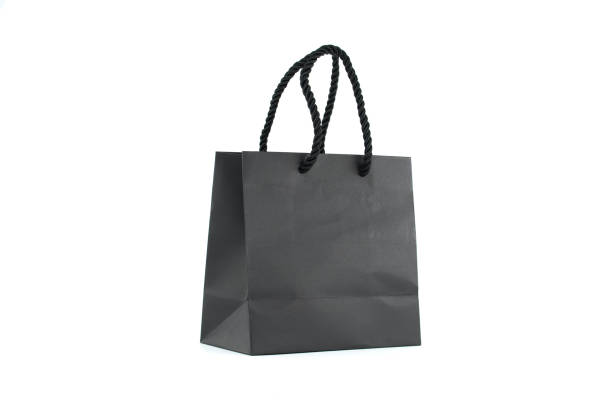 istock Black paper shopping bag isolated on white 1440673294