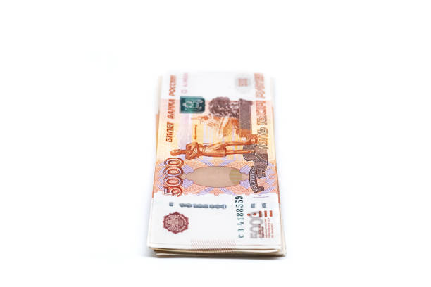 istock Some five thousand rubles bills. Stack of Russian cash on white. 1440673342