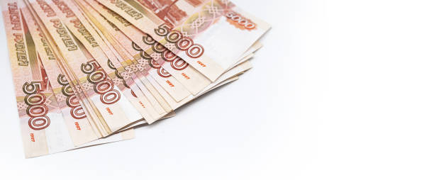 istock Some five thousand rubles bills. Stack of Russian cash on white. 1440673421